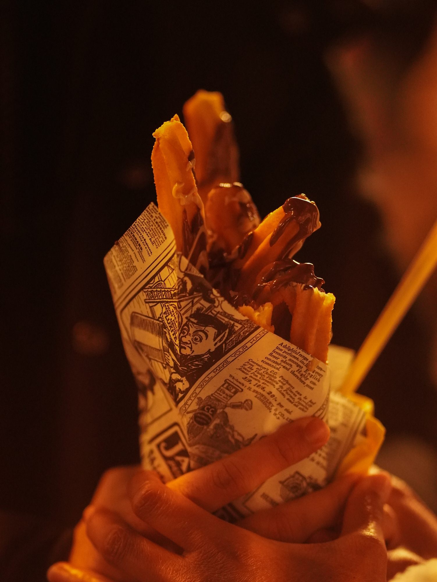 Street food wrapped in printed paper