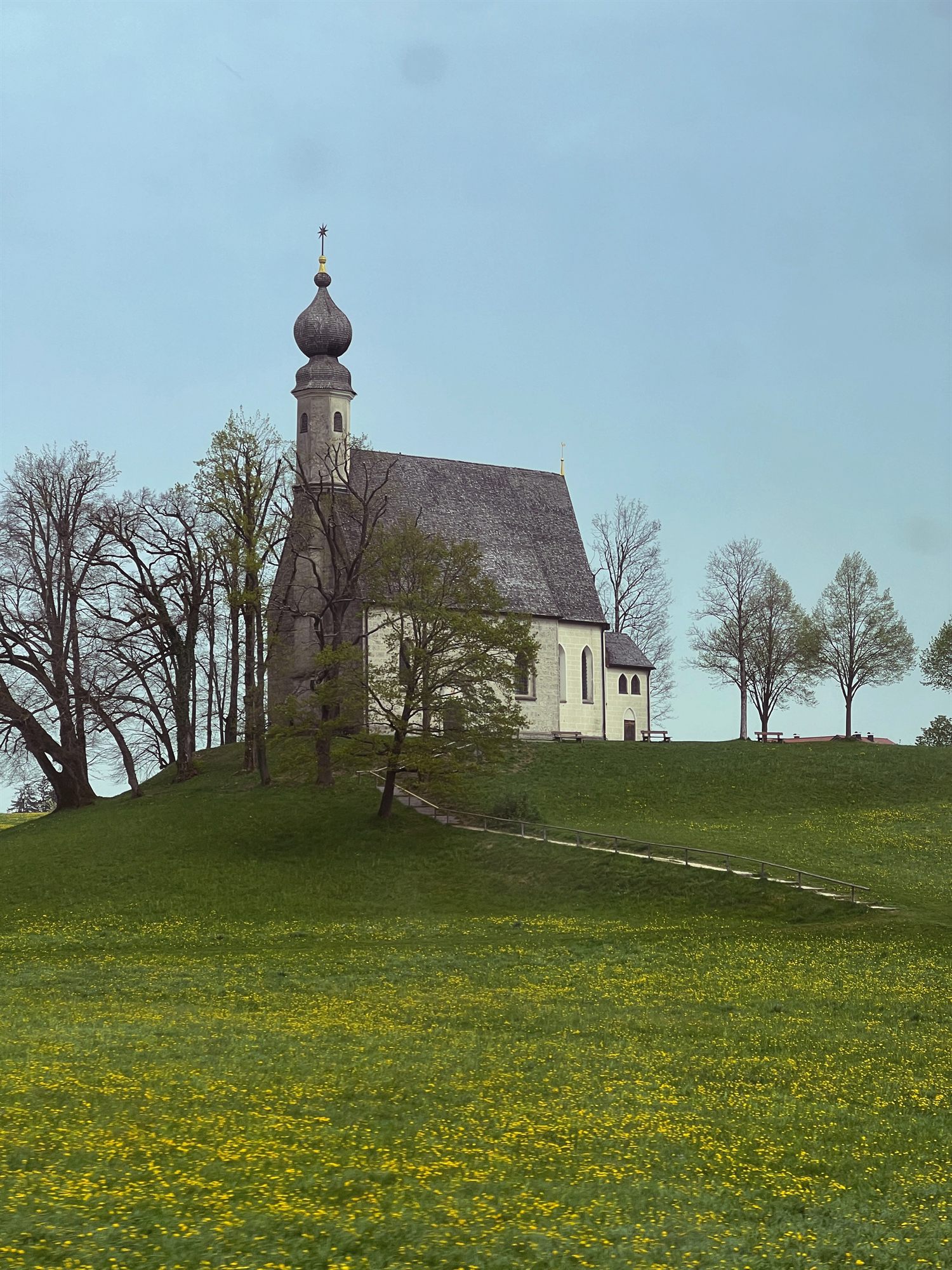 Chapel on a hill under a moody sky